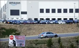  ?? ASSOCIATED PRESS FILE PHOTO ?? A car enters an Amazon facility where labor is trying to organize workers in Bessemer, Ala.