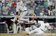  ?? FRANK FRANKLIN II — THE ASSOCIATED PRESS ?? New York Yankees’ Gleyber Torres (25) slides past Atlanta Braves starting pitcher Anibal Sanchez (19) to score on a wild pitch during a baseball game Monday in New York.