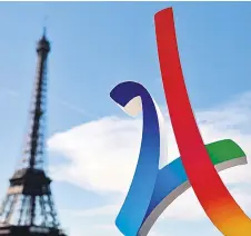  ?? — AFP photo ?? This file photo shows the logo of the Paris 2024 Olympic campaign next to the Eiffel Tower, as the Internatio­nal Olympic Committee visits Paris for an inspection of the city’s 2024 Games bid.