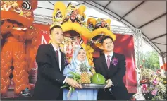  ??  ?? (From left) Chai, Rubiah and Wilson hold a tray of fruits during the ML Home Mart opening ceremony yesterday.