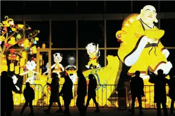  ??  ?? People visit a lantern show to mark the upcoming Chinese Lantern Festival in Haozhou, Anhui province, China. — Reuters photo