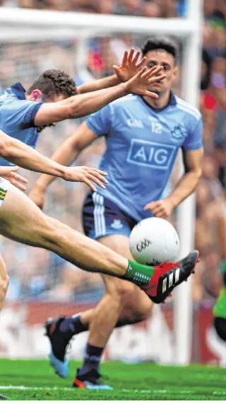  ??  ?? Game of inches: Jack McCaffrey attempts to block David Clifford’s effort on goal. How Dublin cope with the threat of the Kerry talisman is likely to have a huge bearing on today’s game