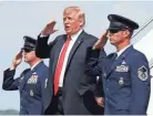  ?? PABLO MARTINEZ MONSIVAIS/AP ?? President Donald Trump salutes on his arrival on Air Force One in Morristown, N.J., Friday, en route to Trump National Golf Club in Bedminster, N.J.