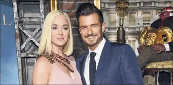  ?? Chris Pizzello / Associated Press ?? Orlando Bloom, right, said he was “one proud partner” following Katy Perry’s performanc­e in the “Celebratin­g America” inaugurati­on night primetime TV special on Wednesday.
