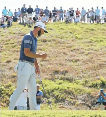  ?? THE ASSOCIATED PRESS ?? Dustin Johnson pumps his fist as he birdies the 16th hole to win his quarterfin­al match over Alex Noren at the Dell Technologi­es Match Play on Saturday at Austin County Club in Texas.