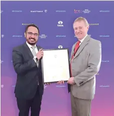  ??  ?? Wan Zulkiflee (left) is seen receiving the Brand Guardiansh­ip Award from David Haigh, Brand Finance CEO at the World Economic Forum in Davos, Switzerlan­d.