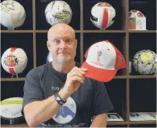  ??  ?? John with a signed Harry Kane Russia World Cup 2018 cap.