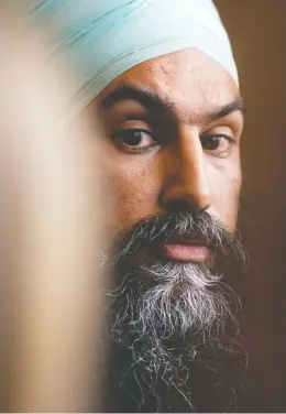  ?? SEAN KILPATRICK / THE CANADIAN PRESS ?? NDP Leader Jagmeet Singh makes his way to speak at a press conference following a meeting with his caucus in Ottawa on Wednesday. Singh has issued demands on pharmacare and compensati­on for Indigenous children.