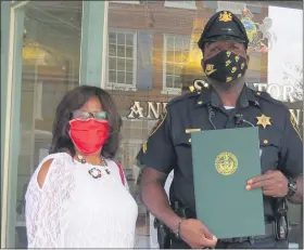  ?? SUBMITTED PHOTO ?? Shannon-Bailey of the Coatesvill­e Area Juvenile Justice Alliance (left) presents a special Senate citation to Corporal Stanley McDaniel (center) in recognitio­n of his work mentoring young people