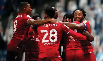  ??  ?? Reading’s players celebrate after Yakou Méïté scored inside the first 10 seconds against Blackburn. Photograph: Clive Brunskill/Getty Images