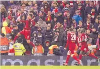  ?? Photo / AP ?? Liverpool’s Roberto Firmino celebrates his goal against Atletico Madrid in their second leg Champions League tie at Anfield.