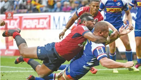  ?? Photo: Zimbio ?? Wilco Louw of the Stormers cops a Samu Kerevi tackle as Filipo Daugunu looks on during the Super Rugby match against the Reds at DHL Newlands Stadium in Cape Town, South Africa on March 24, 2018.
