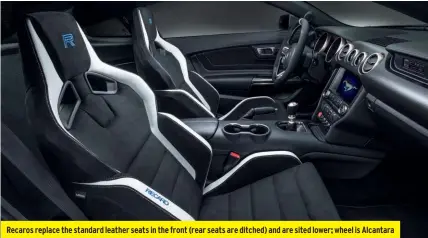  ??  ?? Recaros replace the standard leather seats in the front (rear seats are ditched) and are sited lower; wheel is Alcantara