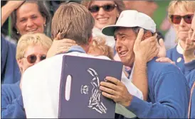  ??  ?? A tearful Seve Ballestero­s greets Nick Faldo after the Englishman’s Sunday Singles victory over Curtis Strange