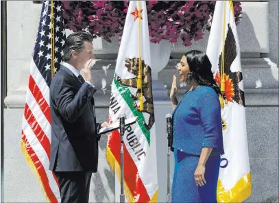  ?? Marcio Jose Sanchez ?? The Associated Press California Lt. Gov. Gavin Newsom, left, swears in London Breed as San Francisco’s new mayor Wednesday outside City Hall.