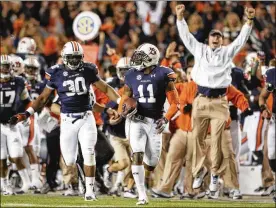  ?? ASSOCIATED PRESS ?? Auburn cornerback Chris Davis returns a missed field-goal attempt 100-plus yards for the winning touchdown as time expires in the fourth quarter against No. 1 Alabama, completing one of the most memorable plays in college football history.