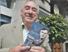  ??  ?? Tom Caskie with the book which recount his uncle’s bravery and exploits