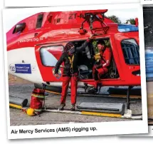  ??  ?? Air Mercy
Services (AMS) rigging up.
Team members prepare to launch.