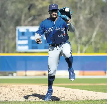  ?? NATHAN DENETTE/THE CANADIAN PRESS ?? Toronto Blue Jays starting pitcher Marcus Stroman catches a ball during baseball spring training in Dunedin, Fla., on Monday.