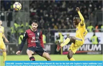  ??  ?? CAGLIARI: Juventus’ French midfielder Blaise Matuidi (R) vies for the ball with Cagliari’s Italian midfielder Luca Cigarini during the Italian Serie A football match between Cagliari Calcio and Juventus at the Sardegna Arena stadium in Cagliari, on the...