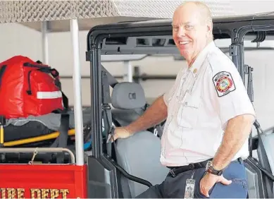  ?? STEPHEN M. DOWELL/ORLANDO SENTINEL ?? Carle Bishop, who is retiring as Clermont Fire Chief, stands at Clermont Fire Station No. 1 on Wednesday.