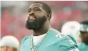  ?? JASON BEHNKEN/AP ?? Dolphins offensive tackle Terron Armstead looks on before Saturday’s game in Tampa.