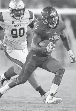  ?? JIM RASSOL/SUN SENTINEL ?? Florida Atlantic junior Kerrith Whyte Jr., right, was expected to be the starting running back next season with Devin Singletary’s departure.