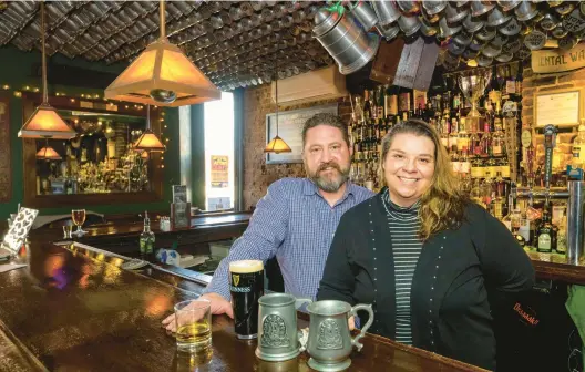  ?? APRIL GAMIZ/MORNING CALL PHOTOS ?? Christine and Ryan Piper pose Thursday inside Porters’ Pub. The Pipers, who met at Porters’ and later married, are the new owners of the Easton bar.