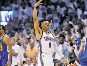  ?? AP/SUE OGROCKI ?? Oklahoma City Thunder guard Russell Westbrook (0) celebrates Tuesday against the Golden State Warriors during the Western Conference finals in Oklahoma City.