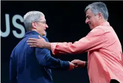  ??  ?? Apple’s senior vice-president of Internet Software and Services Eddy Cue (right) greets Apple CEO Tim Cook during the Apple WWDC in San Francisco at the conference.