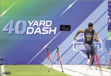  ?? MICHAEL CONROY / AP ?? Ohio State wide receiver Curtis Samuel runs a 4.31-second 40-yard dash at the NFL scouting combine in Indianapol­is on Saturday, second only to Washington wide receiver John Ross’ record-breaking 4.22.