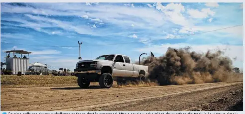  ??  ?? Daytime pulls are always a challenge as far as dust is concerned. After a couple weeks of hot, dry weather, the track in Lewistown simply absorbed whatever water the crew threw at it and turned to dust once again. That said, the track was biting hard enough to eat a few driveshaft­s on the day.