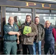  ??  ?? Pictured at the official launch of the nine defibrilla­tors were, left to right: Tomos Hughes (Welsh Ambulance Service), Paul Lewin (Ffestiniog & Welsh Highland Railways general manager), Alun Tomlinson and Howard Wilson.
ROGER DIMMICK / FF&WHR