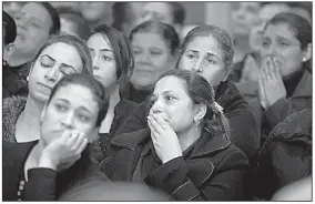  ?? AP/AMR NABIL ?? Relatives attend the funeral of Coptic Christians killed in Friday’s attack on Mar Mina church in Cairo.