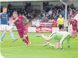  ??  ?? Bobby Linn turns away after putting Arbroath 2-1 up