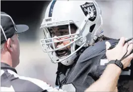  ?? Heidi Fang ?? Las Vegas Review-journal @Heidifang Raiders offensive tackle Donald Penn has words with an official during the first half Sunday against the New York Jets in Oakland, Calif.