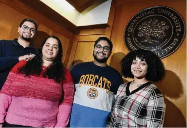  ?? Arnold Gold/Hearst Connecticu­t Media ?? From left, Sebastian Vacco, with his younger triplet siblings, Ashley, Lucas and Jade, at Quinnipiac University in Hamden last week. The triplets from Nanuet, N.Y., all transferre­d to Quinnipiac.