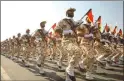  ??  ?? Revolution­ary Guards on parade