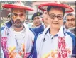  ??  ?? Union Minister of Youth Affairs and Sports Kiren Rijiju and Bollywood actor Sunil Shetty being felicitate­d with traditiona­l outfits