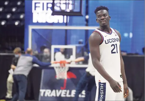  ?? Jessica Hill / Associated Press ?? UConn’s Adama Sanogo watches First Night festivitie­s on Friday in Storrs.