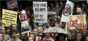  ??  ?? Protesters hold placards during abortion demonstrat­ions in Ireland in 2018.