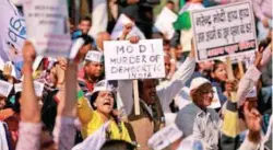  ??  ?? People gather in central Delhi for a protest against the cash ban yesterday.