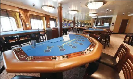  ?? ROSLAN RAHMAN/AFP ?? A poker table is seen at the gaming hall inside the Regent Seven Seas Voyager cruise ship in Singapore on April 12. The AI progam ‘Liberatus’ is currently facing off against the world’s top poker players in what could be an emormous breakthrou­gh for...