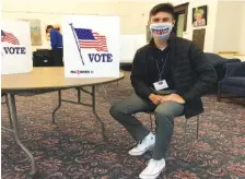  ?? STAFF PHOTO BY MARK KENNEDY ?? Hamilton County poll worker Dante’ Keoke takes a break during his Election Day shift at the Northside Presbyteri­an Church precinct. Earlier this year, Keoke became the first 16- year- old to serve as a precinct worker.