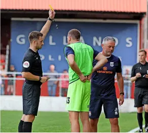  ?? ?? Manager Jerry Gill is shown a yellow card by referee Ben Atkinson