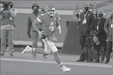  ??  ?? On the move: Kansas City Chiefs quarterbac­k Chad Henne scrambles up field during the second half of an NFL divisional round football game against the Cleveland Browns Sunday in Kansas City.