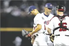  ?? AP PHOTO/ ?? United States pitcher Nick Martinez (left) exits during the third inning of a World Baseball Classic game against Mexico in Phoenix on Sunday.