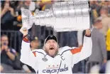  ?? MARK J. TERRILL/ASSOCIATED PRESS ?? Washington’s Alex Ovechkin (8) hoists the Stanley Cup after the Capitals ousted the expansion Vegas Golden Knights in Las Vegas on Thursday night.