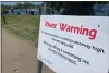  ?? HAVEN DALEY — THE ASSOCIATED
PRESS ?? This sign sums up the situation in the American River in Sacramento, California, as the record snowpack melts in the mountains and rivers turn from gentle into raging.