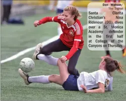  ?? Dan Watson/ The Signal ?? Santa Clarita Christian’s Nina Ridenour (00) dives over a St. Monica Academy defender in the first half at College of the Canyons on Thursday.